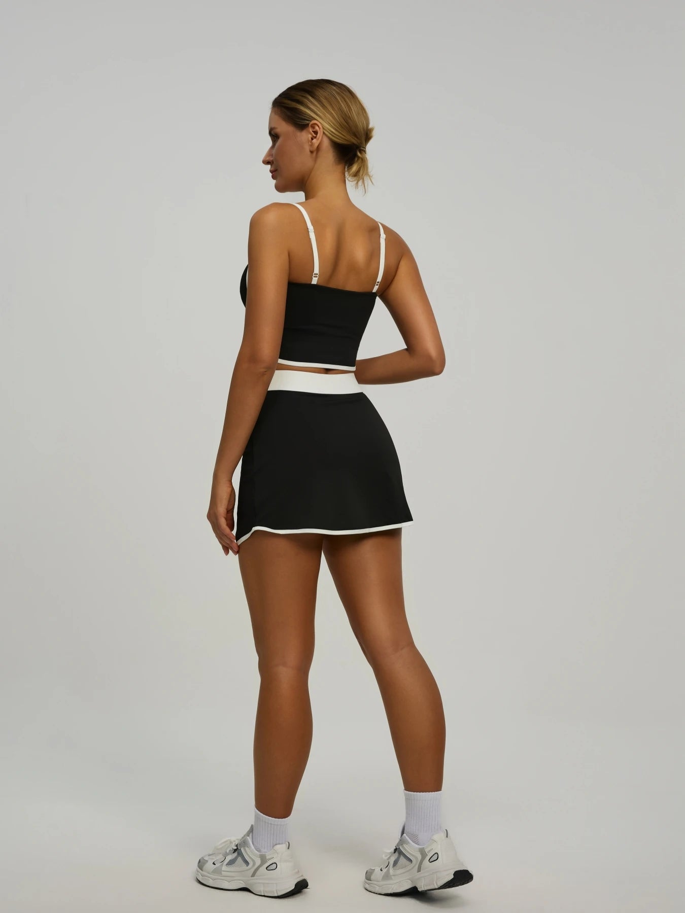 Elevate Your Workout with Our Women's Padded Crop Top and Skort Set - Featuring Hidden Pockets for Ultimate Convenience!