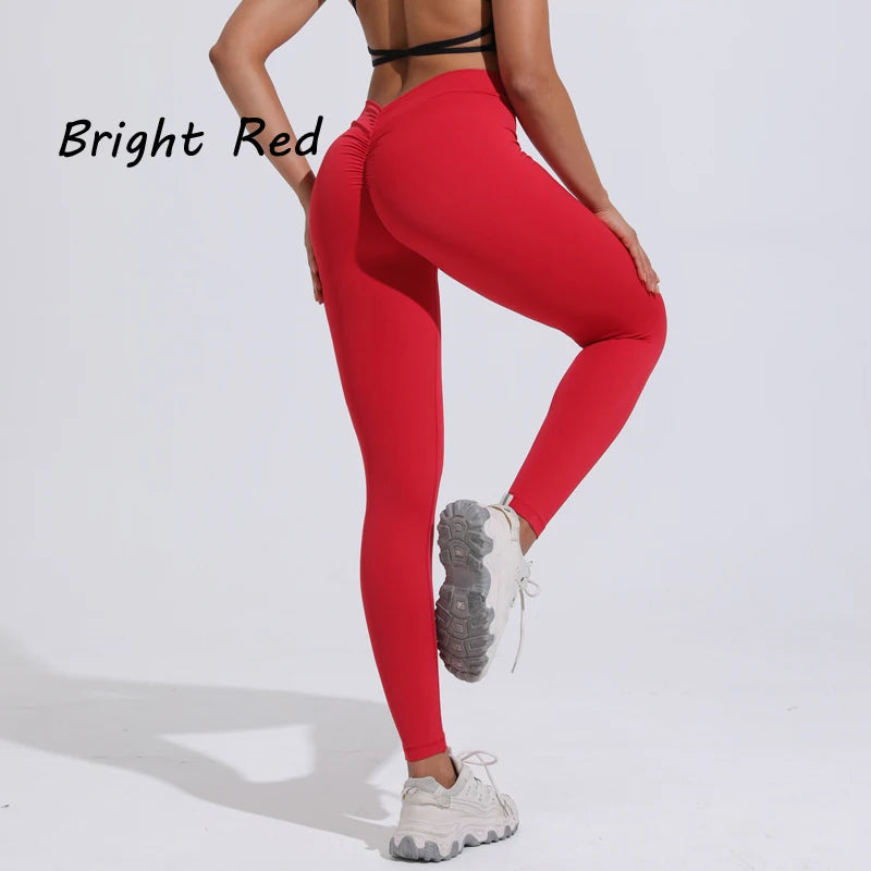 Bright red women's yoga pants featuring a high V-waist design, tailored for a flattering fit and athletic style.