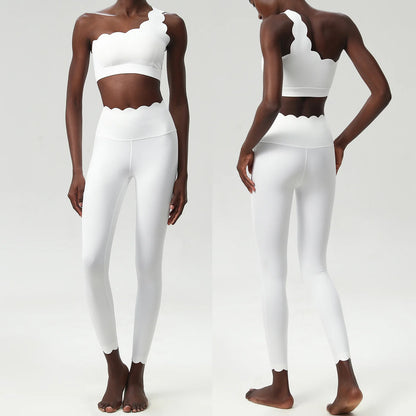 Stylish two-piece fitness yoga set featuring a scalloped crop top and form-fitting leggings in a chic white design.