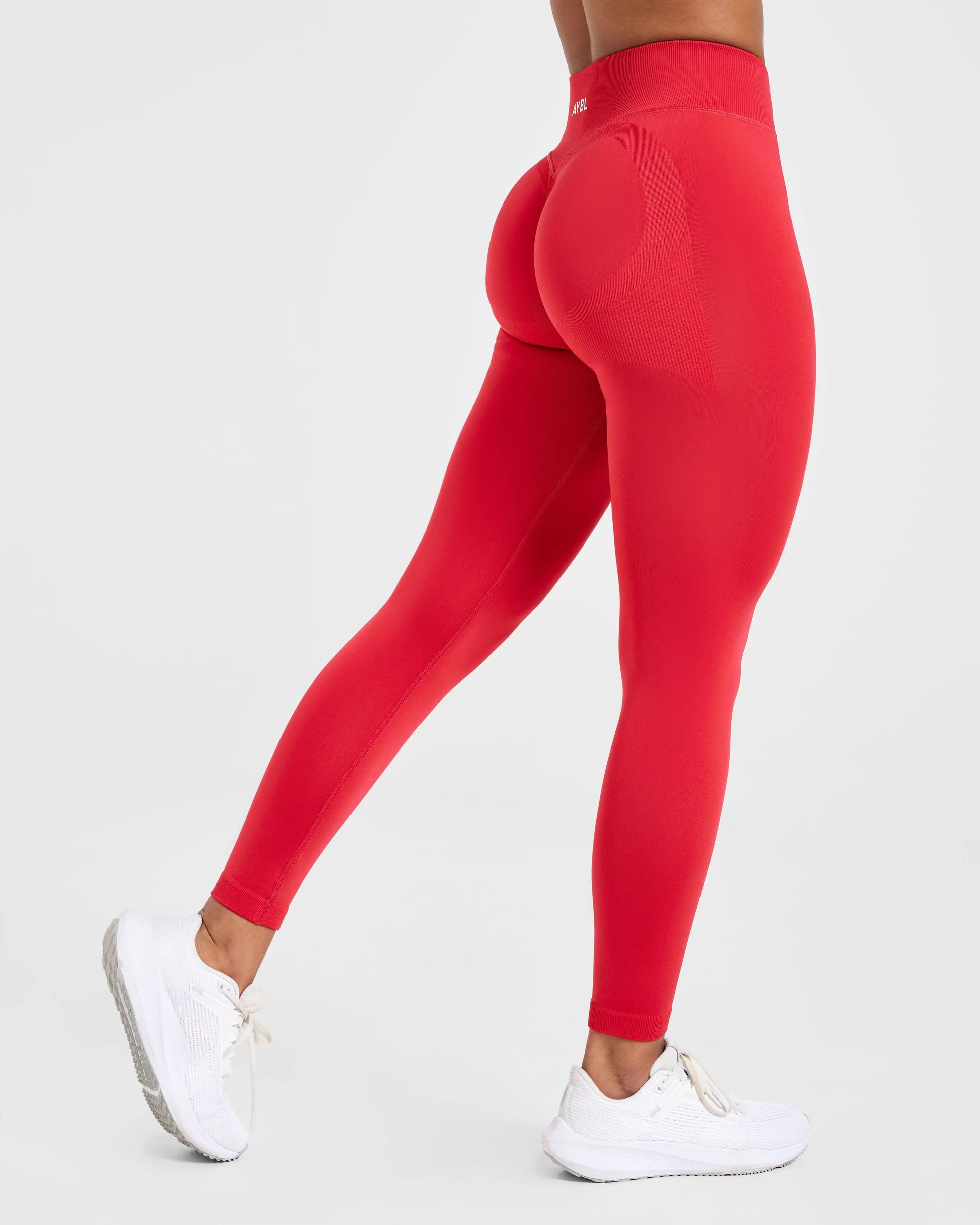 Red Adapt Seamless Leggings featuring a low ribbed band and scrunch design, ideal for yoga and fitness activities.