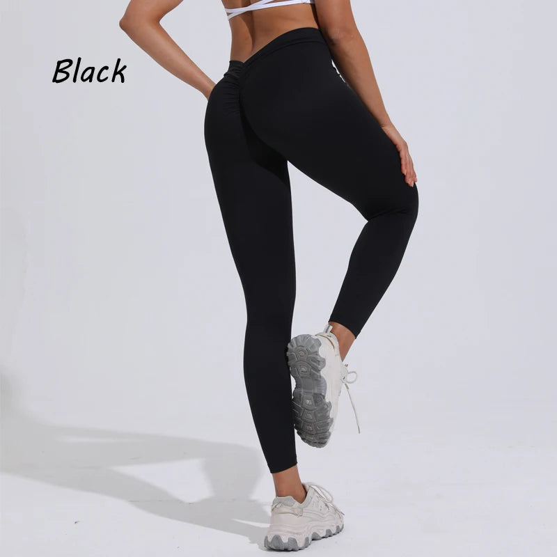 Women's black yoga pants featuring a high V-waist design and gathered detail for enhanced buttocks.