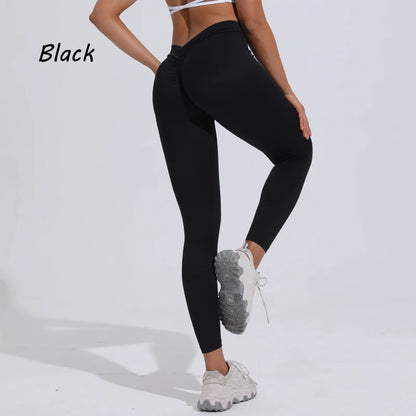 Women's black yoga pants featuring a high V-waist design and gathered detail for enhanced buttocks.