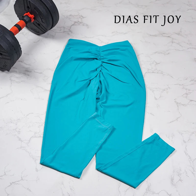 Women's yoga pants in solid color with high waist design and gathered back detail for a flattering, buttocks lifting effect.