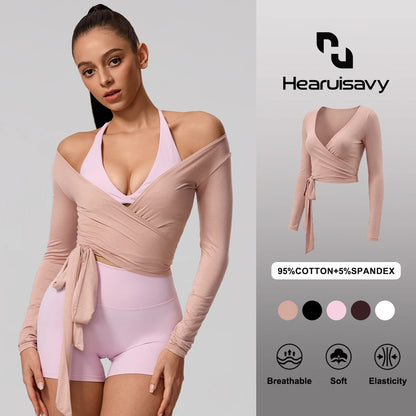 Soft pink long sleeve wrap yoga shirt with a flattering V-neckline, perfect for stylish activewear and casual outings.