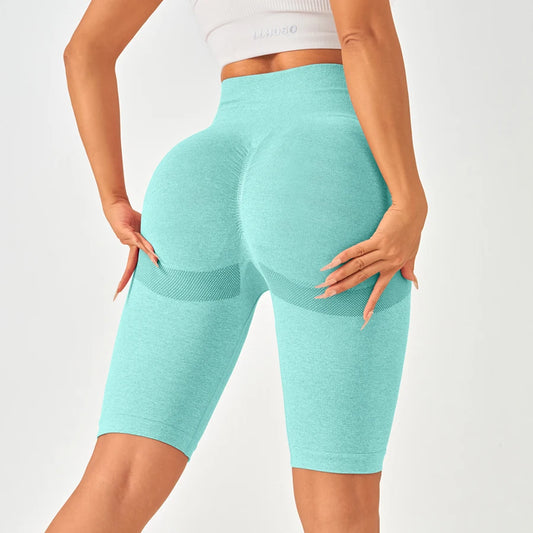 Light aqua high-waisted seamless leggings featuring a butt-lifting design and mesh-like side sections for elegance and comfort.
