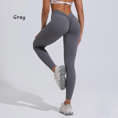 Gray high-waisted yoga pants with a V-waist design, elegantly highlighting the silhouette and buttocks.