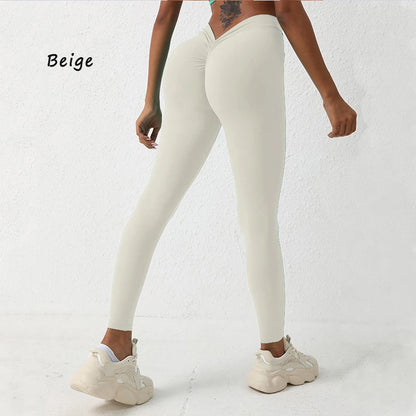 Form-fitting light beige yoga pants with a high V-waist design, perfect for enhancing your silhouette during workouts.