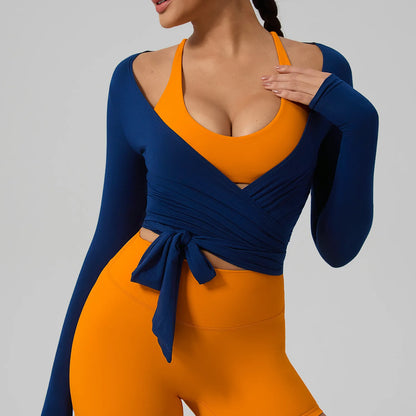 Long sleeve Hearuisavy yoga shirt featuring a chic wrap style and flattering V-neckline in navy blue and orange.