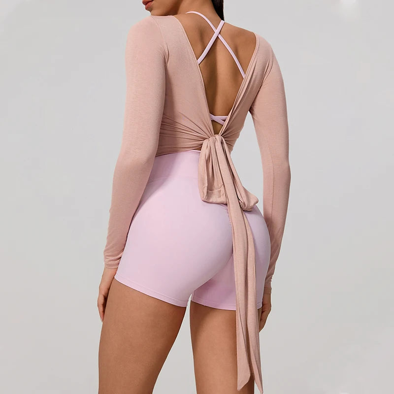 Long sleeve Hearuisavy yoga shirt in a soft neutral tone, featuring a chic wrap design and flattering V-neckline.