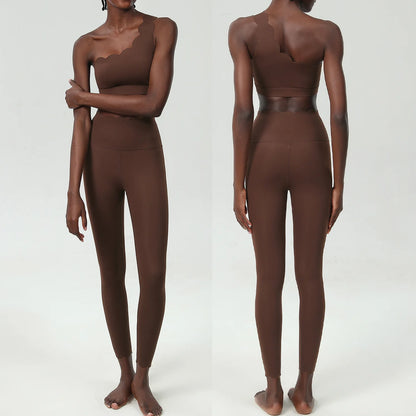 Stylish brown two-piece fitness set featuring a scalloped crop top and form-fitting ankle-length leggings.