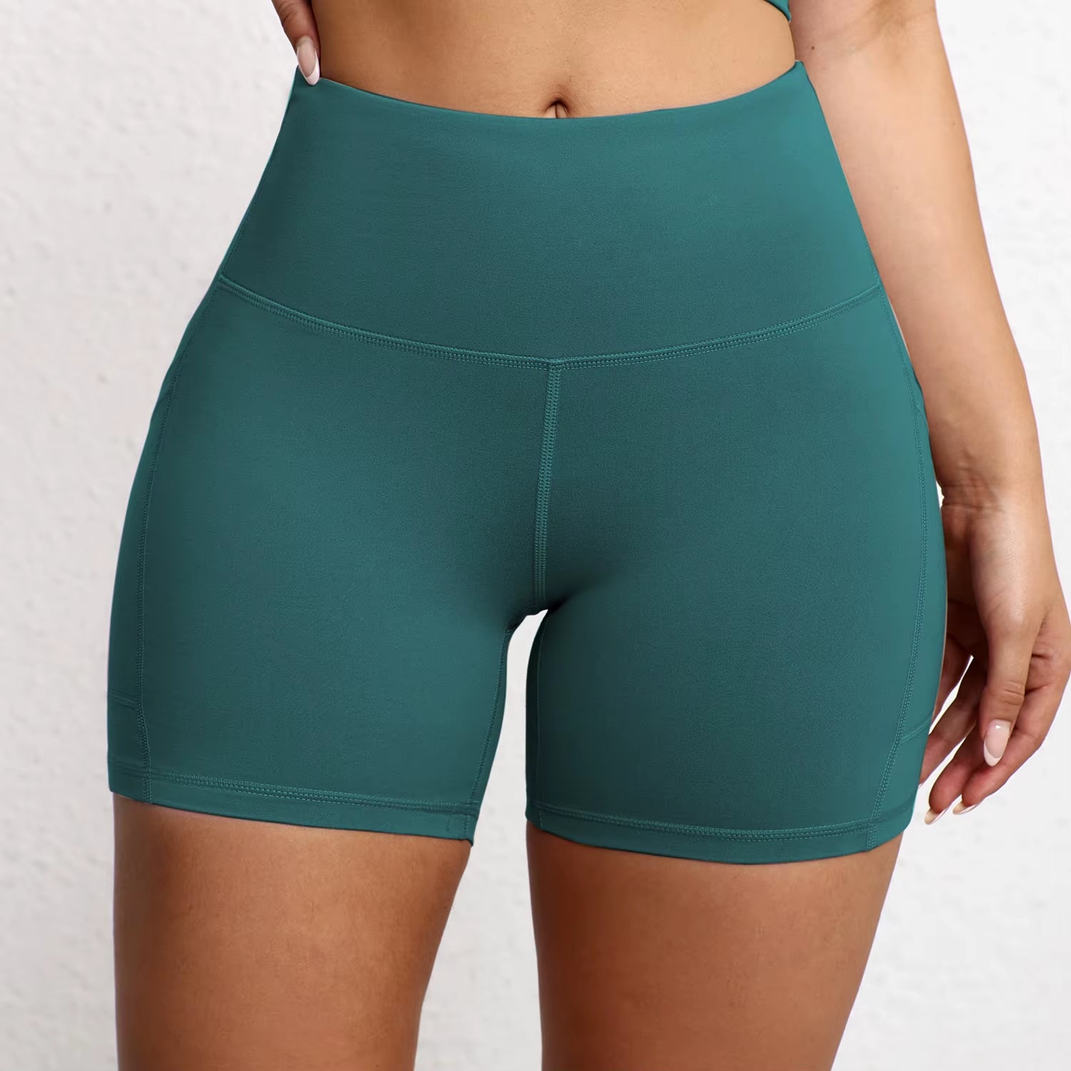 Elevate Your Workout with High Waist Yoga Shorts Featuring Utility Pockets and Butt Lifting Design